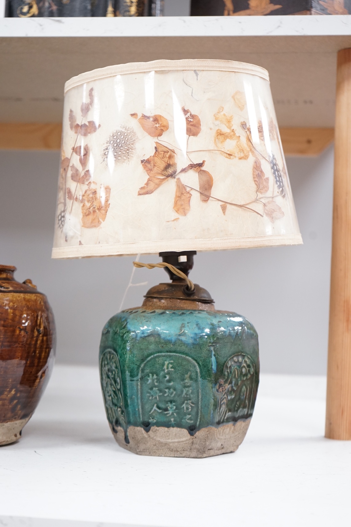 Two Chinese glazed pots, one converted as a lamp with a pressed floral shade, largest overall 37cm high